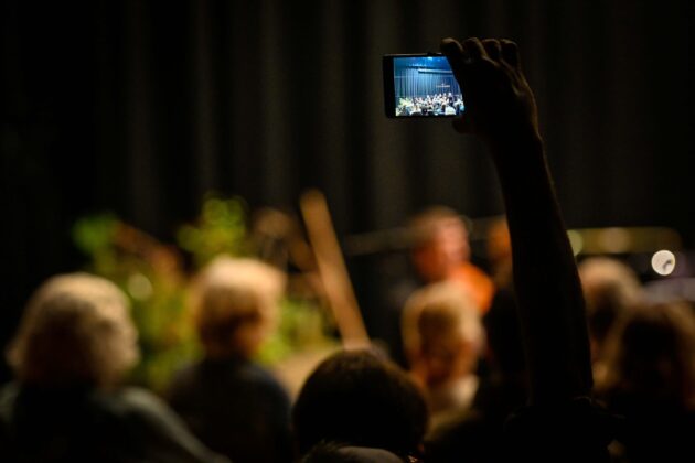 Audience member with phone